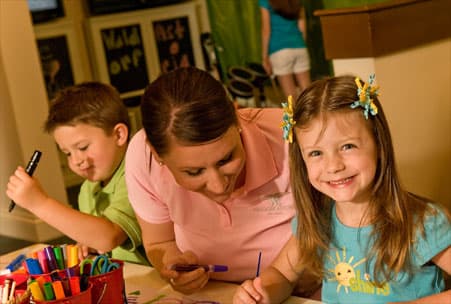 Children doing crafts at the Kids Club