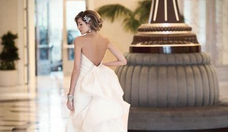 Bride by lobby clock