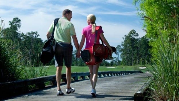 couple with golf bags