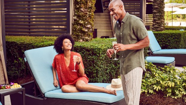 Couple enjoying private poolside cabana