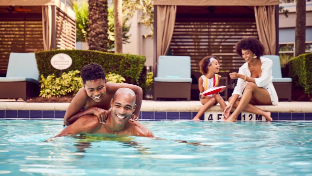 Family enjoying poolside cabana