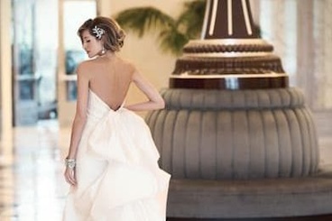 Bride by lobby clock